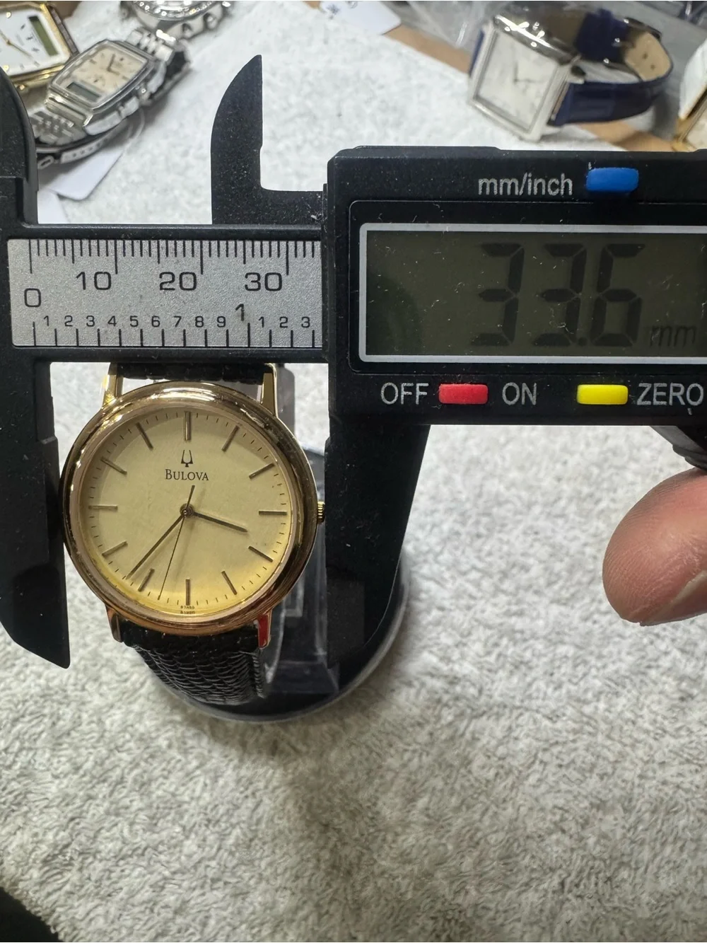 Bulova Gold Dial Men's Watch with Black Leather Strap